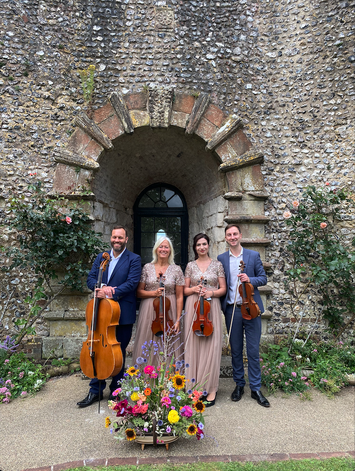 Strings Attached Violins Quartet playing at a wedding at Lewes Castle